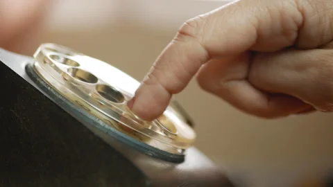 Dialing a phone number using an old vintage rotary telephone Stockbeeldmateriaal 106156174