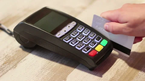 Dialing pin code on pos terminal and swipe card Stock Footage 65392288
