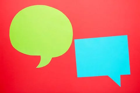 Dialog - two blank speech bubbles on red backgrounnd Stock Photos