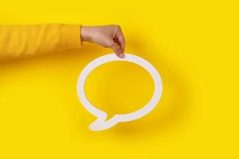 Dialogue bubble in hand Stock Photos