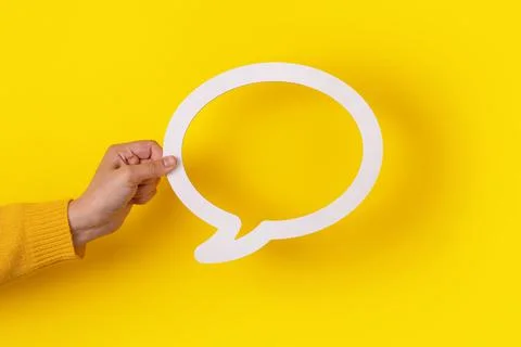 Dialogue bubble in hand Stock Photos