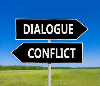 Dialogue instead conflict symbol. Concept words Dialogue and Conflict on be.. Foto stock