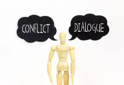 Dialogue instead conflict symbol. Concept words Dialogue and Conflict on be.. 스톡 사진