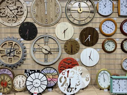 Dials with arrows on an old watch, close-up. Many watches of different sizes  Stock Photos