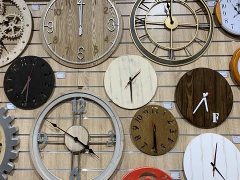 Dials with arrows on an old watch, close-up. Many watches of different sizes  Stock Photos