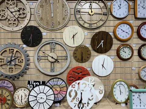 Dials with arrows on an old watch, close-up. Many watches of different sizes  Stock Photos