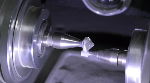 A diamond cemented on a dop spins against girdling stick Stock Footage 61292877