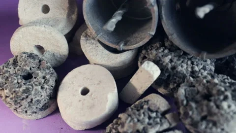 Diamond core drill bit metal construction, solid material particles (compression Stock Footage 128828154