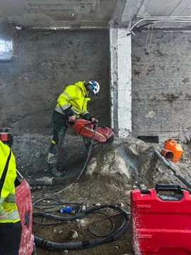 Diamond cutting of granite block using professional construction equipment .. Stock Photos