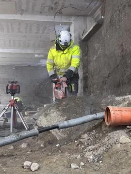 Diamond cutting of granite rock using professional construction equipment d.. Stock Photos