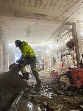 Diamond cutting rock using professional equipment on real construction site Stock Photos