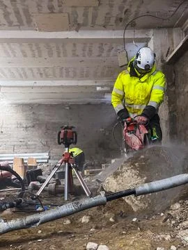 Diamond cutting of rock using professional construction equipment during bu.. Stock Photos