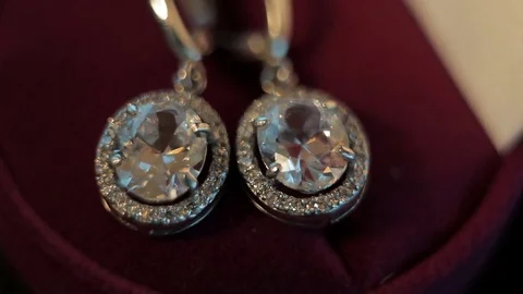 Diamond earrings play on light Stock Footage 75538601
