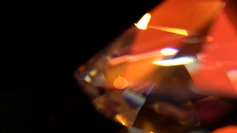 Diamond edge glows with bright multicolored highlights. Black background Video stock 97976881