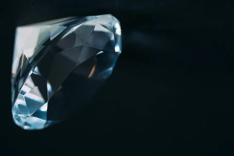 Diamond elements close-up on a black background. Abstraction. Defocused. D... Stock Photos