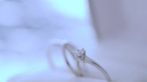 Diamond Engagement Ring and Wedding Band on White Background Stock Footage 336820395