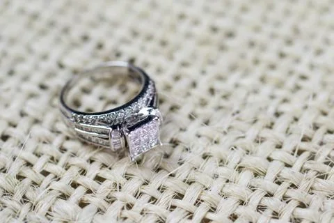 A diamond engagement ring in a box with glint/reflection. Shimmering princess Stock Photos