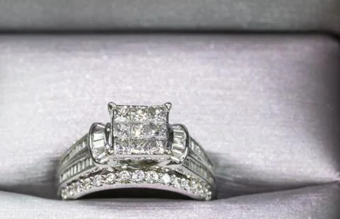 A diamond engagement ring in a box with glint/reflection. Shimmering princess Stock Photos
