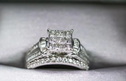 A diamond engagement ring in a box with glint/reflection. Shimmering princess Stock Photos