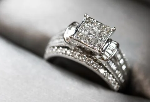 A diamond engagement ring in a box with glint/reflection. Shimmering princess Stock Photos