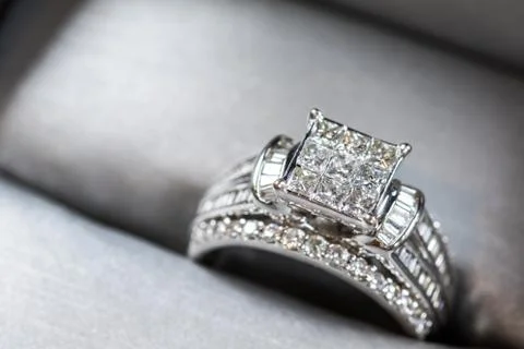 A diamond engagement ring in a box with glint/reflection. Shimmering princess Stock Photos