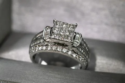 A diamond engagement ring in a box with glint/reflection. Shimmering princess Stock Photos