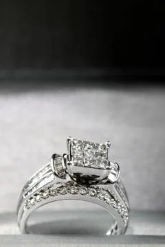 A diamond engagement ring in a box with glint/reflection. Shimmering princess Stock Photos