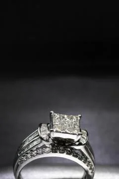 A diamond engagement ring in a box with glint/reflection. Shimmering princess Stock Photos