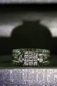 A diamond engagement ring in a box with glint/reflection. Shimmering princess Stock Photos