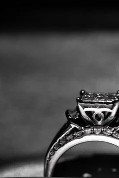 A diamond engagement ring in a box with glint/reflection. Shimmering princess Stock Photos