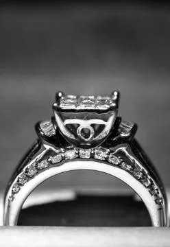 A diamond engagement ring in a box with glint/reflection. Shimmering princess Stock Photos
