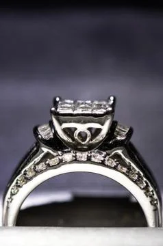 A diamond engagement ring in a box with glint/reflection. Shimmering princess Stock Photos