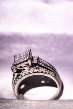 A diamond engagement ring in a box with glint/reflection. Shimmering princess Stock Photos