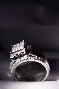 A diamond engagement ring in a box with glint/reflection. Shimmering princess Stock Photos