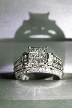 A diamond engagement ring in a box with glint/reflection. Shimmering princess Stock Photos
