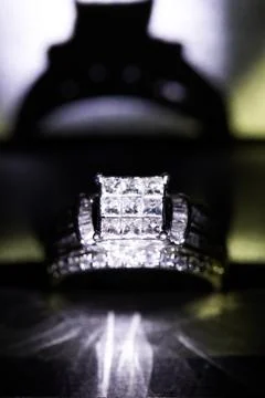 A diamond engagement ring in a box with glint/reflection. Shimmering princess Stock Photos
