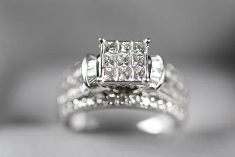 A diamond engagement ring in a box with glint/reflection. Shimmering princess Stock Photos