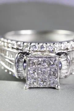 A diamond engagement ring in a box with glint/reflection. Shimmering princess Stock Photos