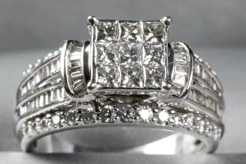 A diamond engagement ring in a box with glint/reflection. Shimmering princess Stock Photos