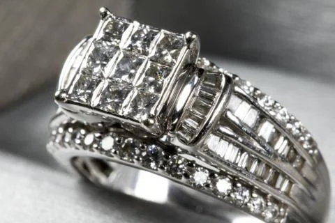A diamond engagement ring in a box with glint/reflection. Shimmering princess Stock Photos