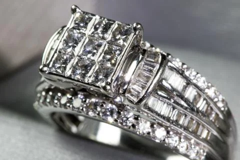 A diamond engagement ring in a box with glint/reflection. Shimmering princess Stock Photos