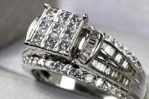 A diamond engagement ring in a box with glint/reflection. Shimmering princess Stock Photos