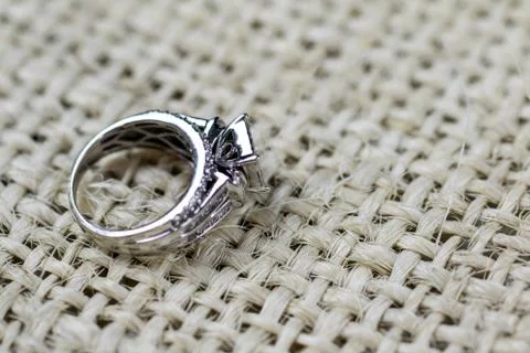 A diamond engagement ring in a box with glint/reflection. Shimmering princess Stock Photos