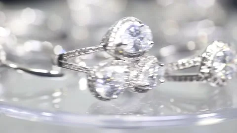 Diamond engagement ring set in spinning on a revolving turntable Stock Footage 139968757