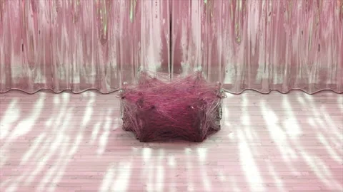Diamond figures bound by a sticky transparent web jump out of the circle in a 스톡 동영상 245989560
