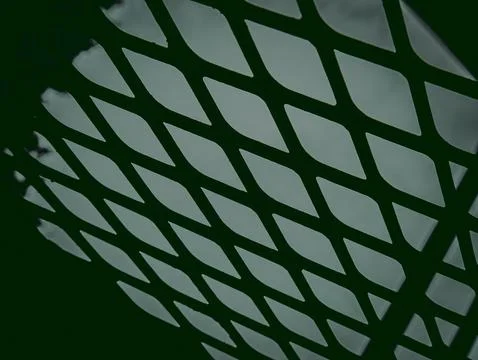 Diamond Mesh Metal Pattern with Backlit Green Glow, Abstract Industrial Textu Stock Photos