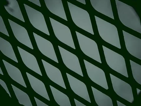 Diamond Mesh Metal Pattern with Backlit Green Glow, Abstract Industrial Textu Stock Photos
