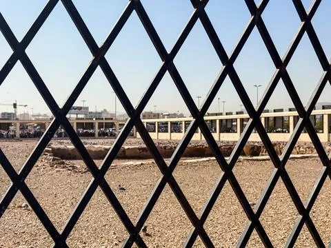 Diamond Pattern Fence Overlooking Al-Baqi Cemetery in Saudi Arabia Stock Photos