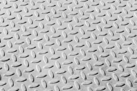 A diamond plate texture, also commonly referred to as checker plate, tread plate Stock Photos