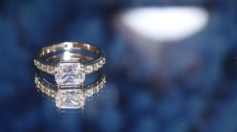 Diamond  ring on blue  background Stock Photos